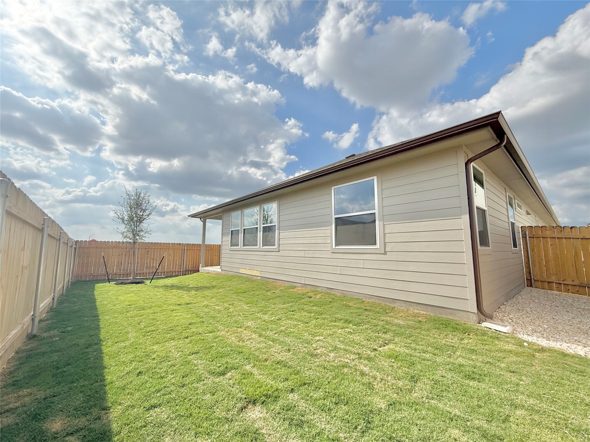 461 Young Street Buda, TX 78610 - Photo 23 of 32 a backyard of a house