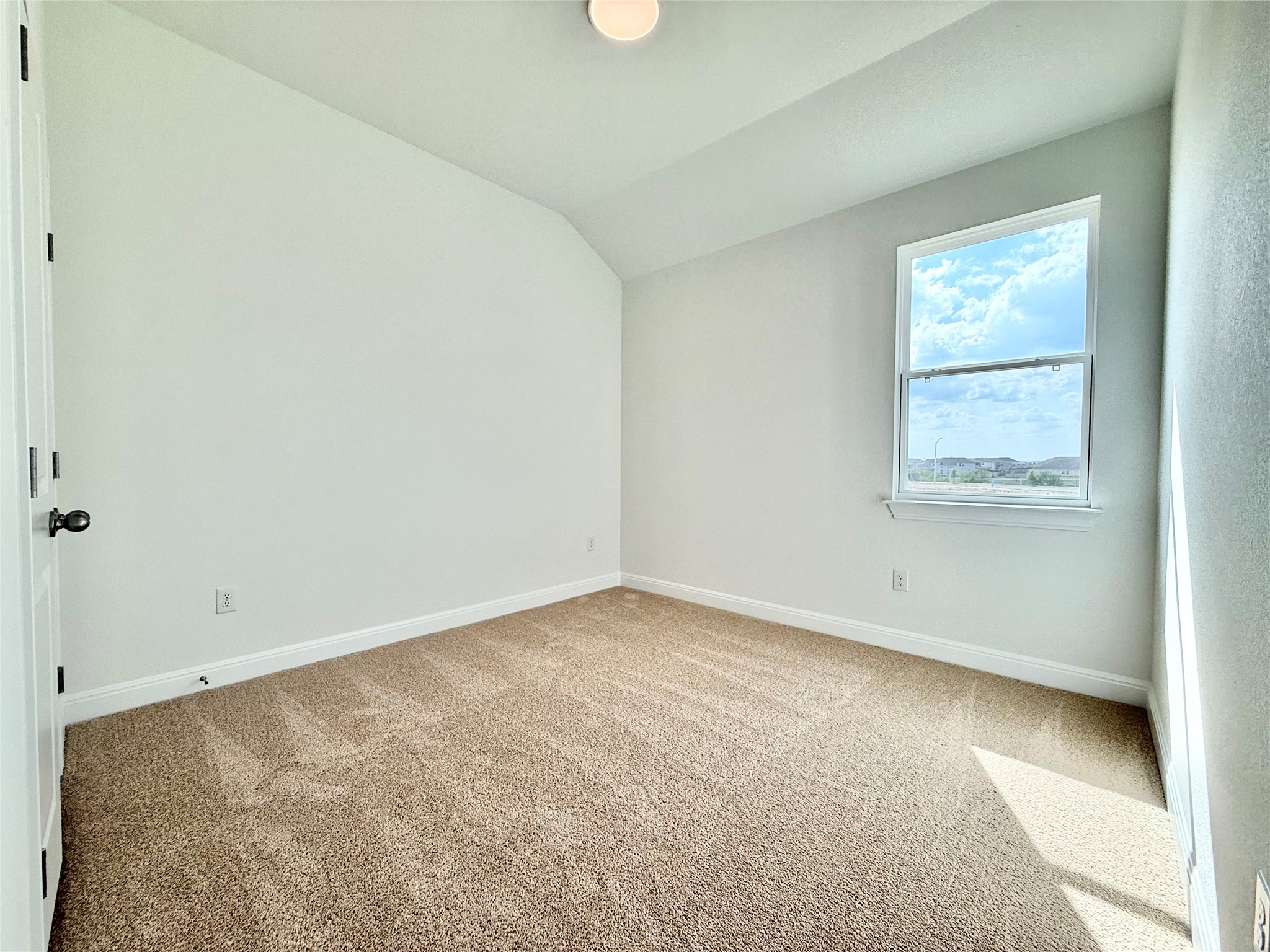 461 Young Street Buda, TX 78610 - Photo 5 of 32 an empty room with a window