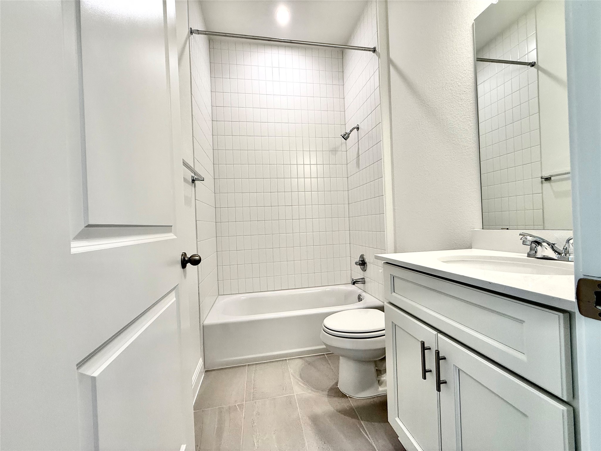 461 Young Street Buda, TX 78610 - Photo 6 of 32 a bathroom with a granite countertop sink toilet and shower