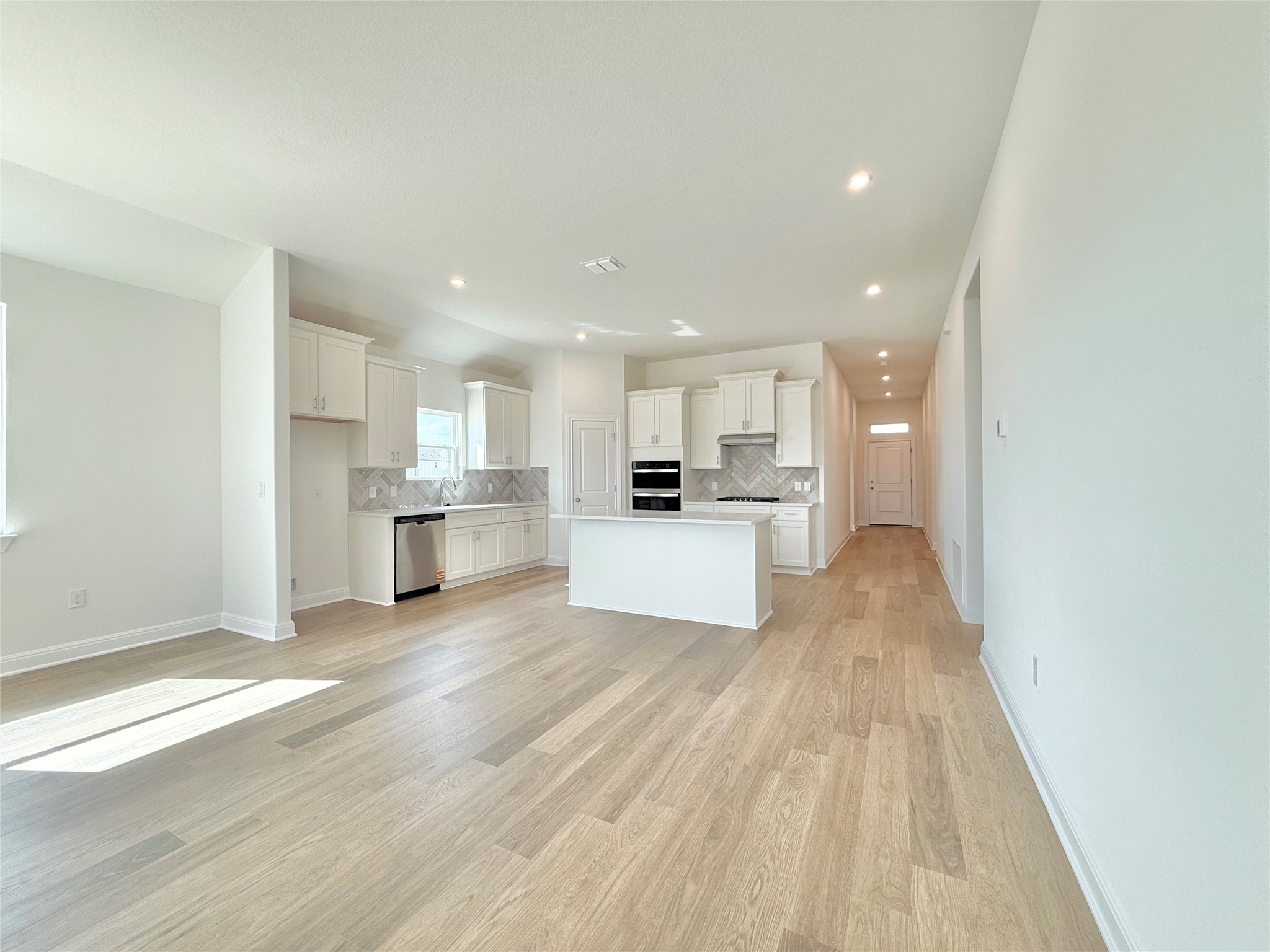 461 Young Street Buda, TX 78610 - Photo 8 of 32 a view of kitchen with wooden floor
