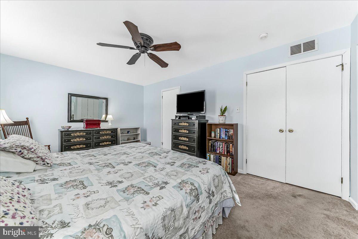 708 Heather Lane Aston, PA 19014 - Photo 19 of 36 a bedroom with a bed and a flat screen tv