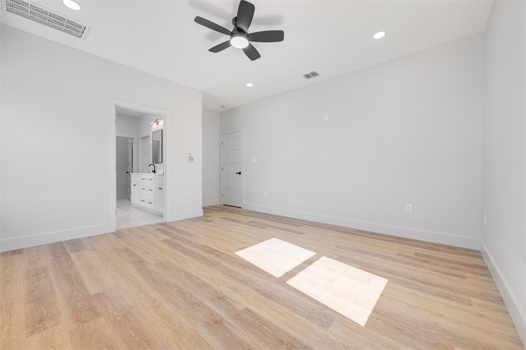 406 Private Road Brookston, TX 75421 - Photo 17 of 37 a view of empty room with wooden floor and fan