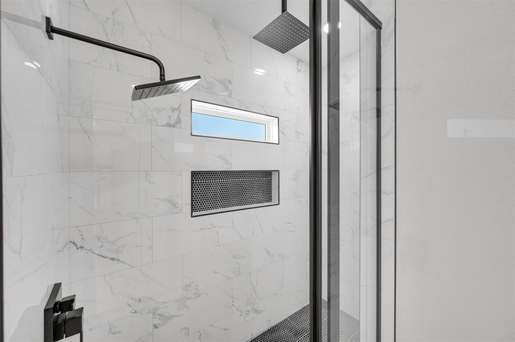 406 Private Road Brookston, TX 75421 - Photo 19 of 37 a bathroom with a shower and a mirror