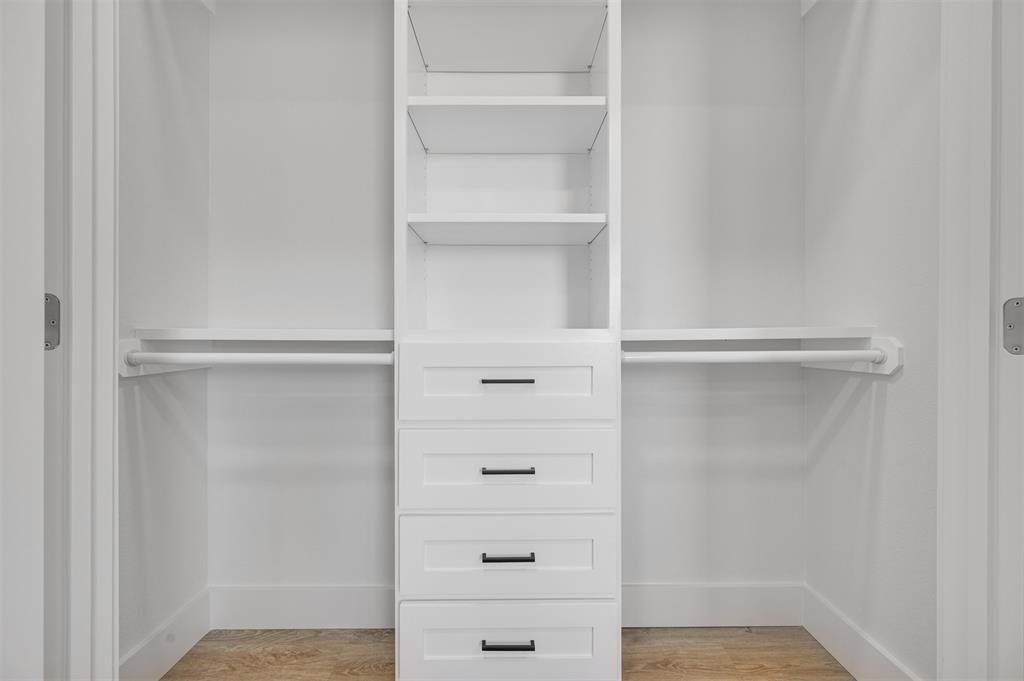 406 Private Road Brookston, TX 75421 - Photo 25 of 37 a view of walk in closet with empty racks