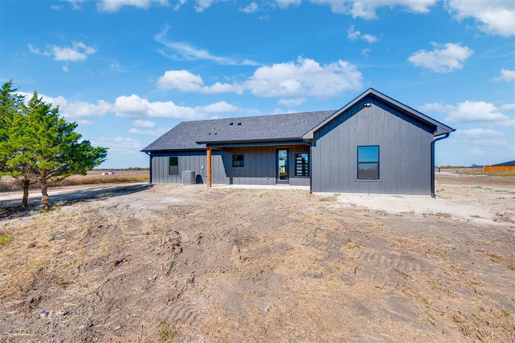 406 Private Road Brookston, TX 75421 - Photo 31 of 37 a front view of a house with a yard