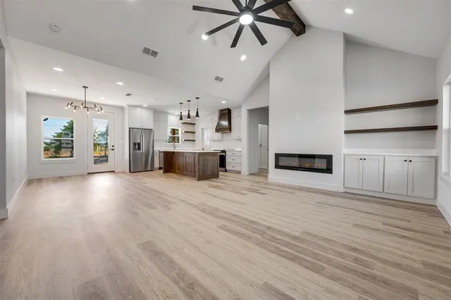 a view of a kitchen with a sink and a stove top oven