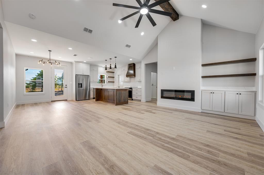 406 Private Road Brookston, TX 75421 - Photo 6 of 37 a view of a kitchen with a sink and a stove top oven