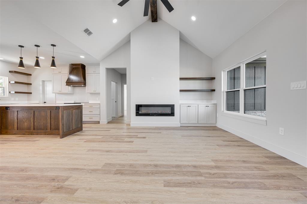406 Private Road Brookston, TX 75421 - Photo 7 of 37 a view of kitchen with wooden floor and electronic appliances