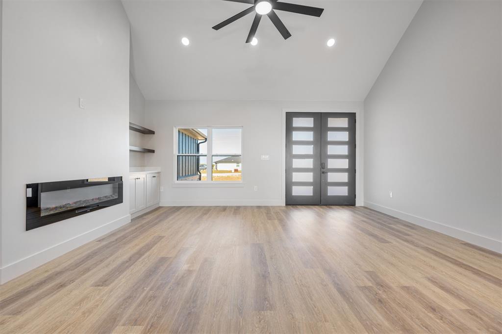 406 Private Road Brookston, TX 75421 - Photo 8 of 37 wooden floor in an empty room with a window