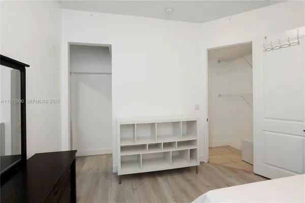 a view of closet area with empty racks