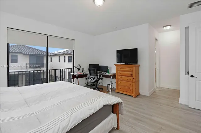 a bathroom with a granite countertop tub sink shower and mirror
