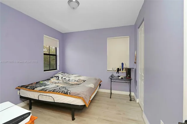 a bedroom with a bed and a table