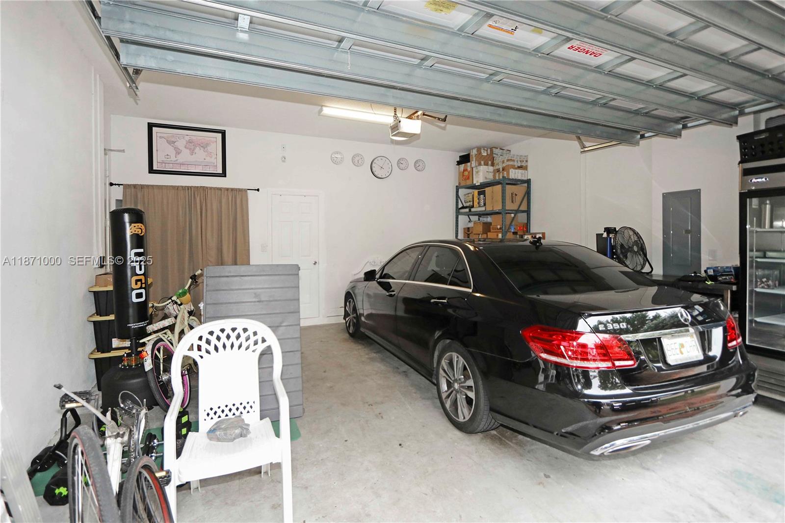 3293 West 98th Place Hialeah, FL 33018 - Photo 32 of 49 a car is parked in a garage