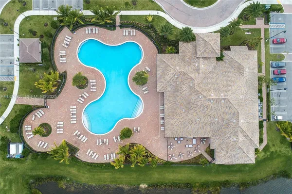 an aerial view of a swimming pool and outdoor space