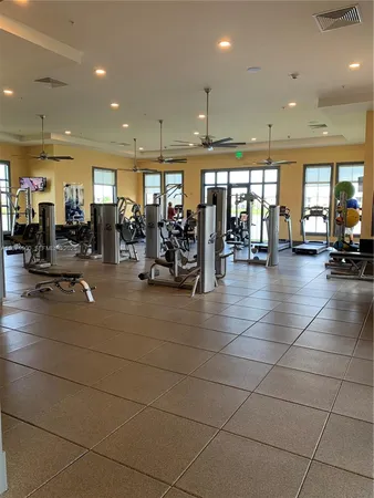 a lobby with gym equipment and a large window