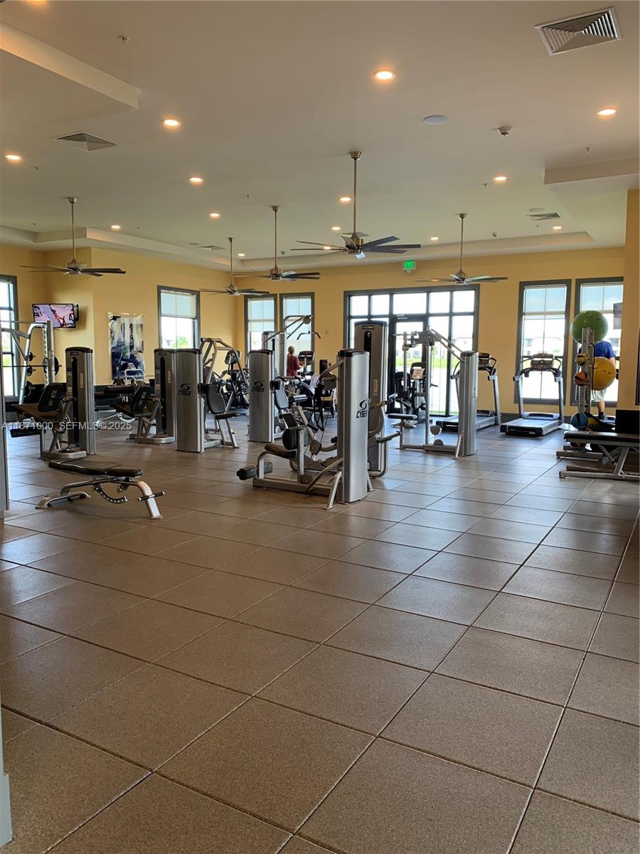3293 West 98th Place Hialeah, FL 33018 - Photo 43 of 49 a lobby with gym equipment and a large window