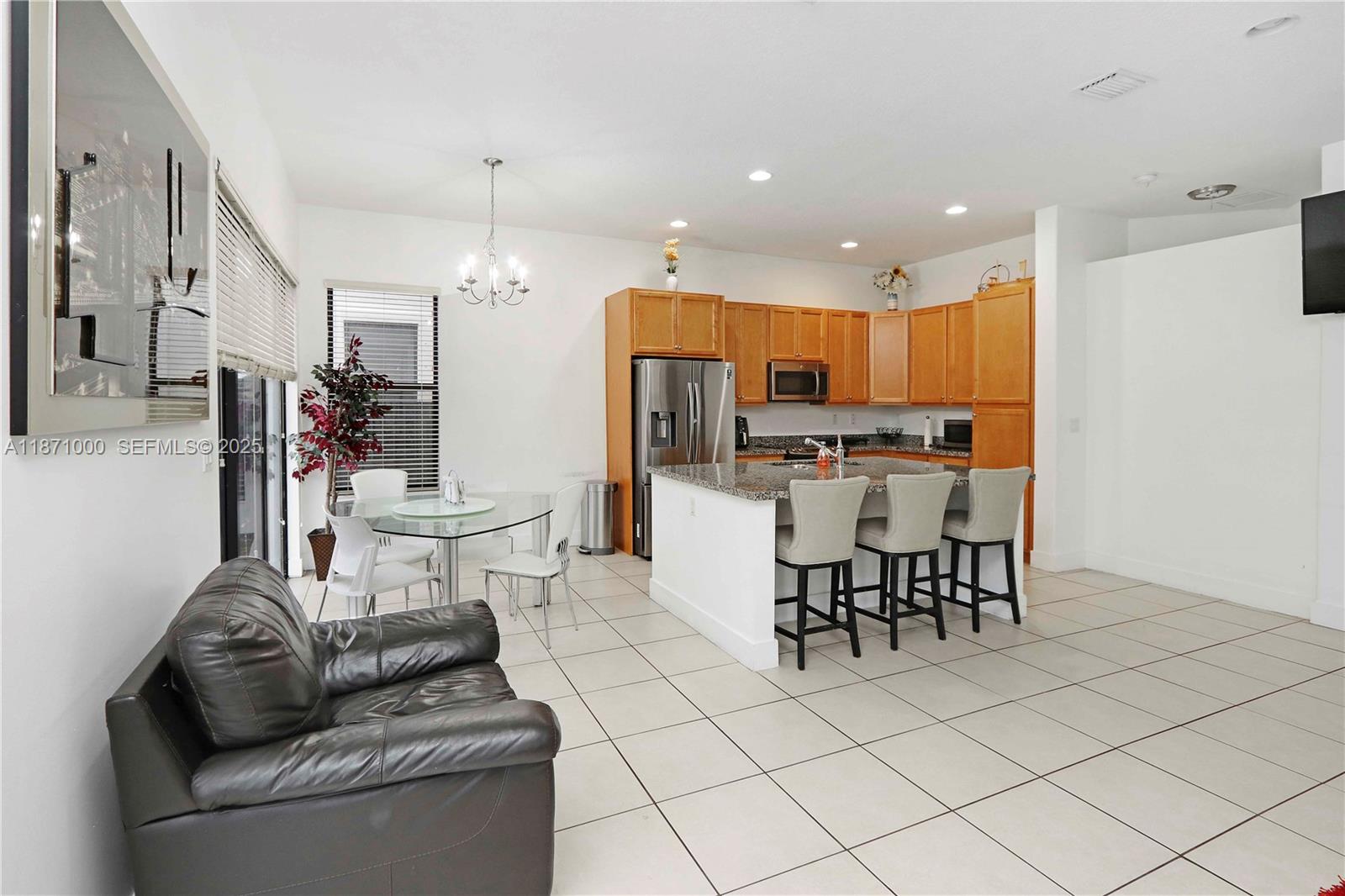 3293 West 98th Place Hialeah, FL 33018 - Photo 5 of 49 a living room with furniture and kitchen view