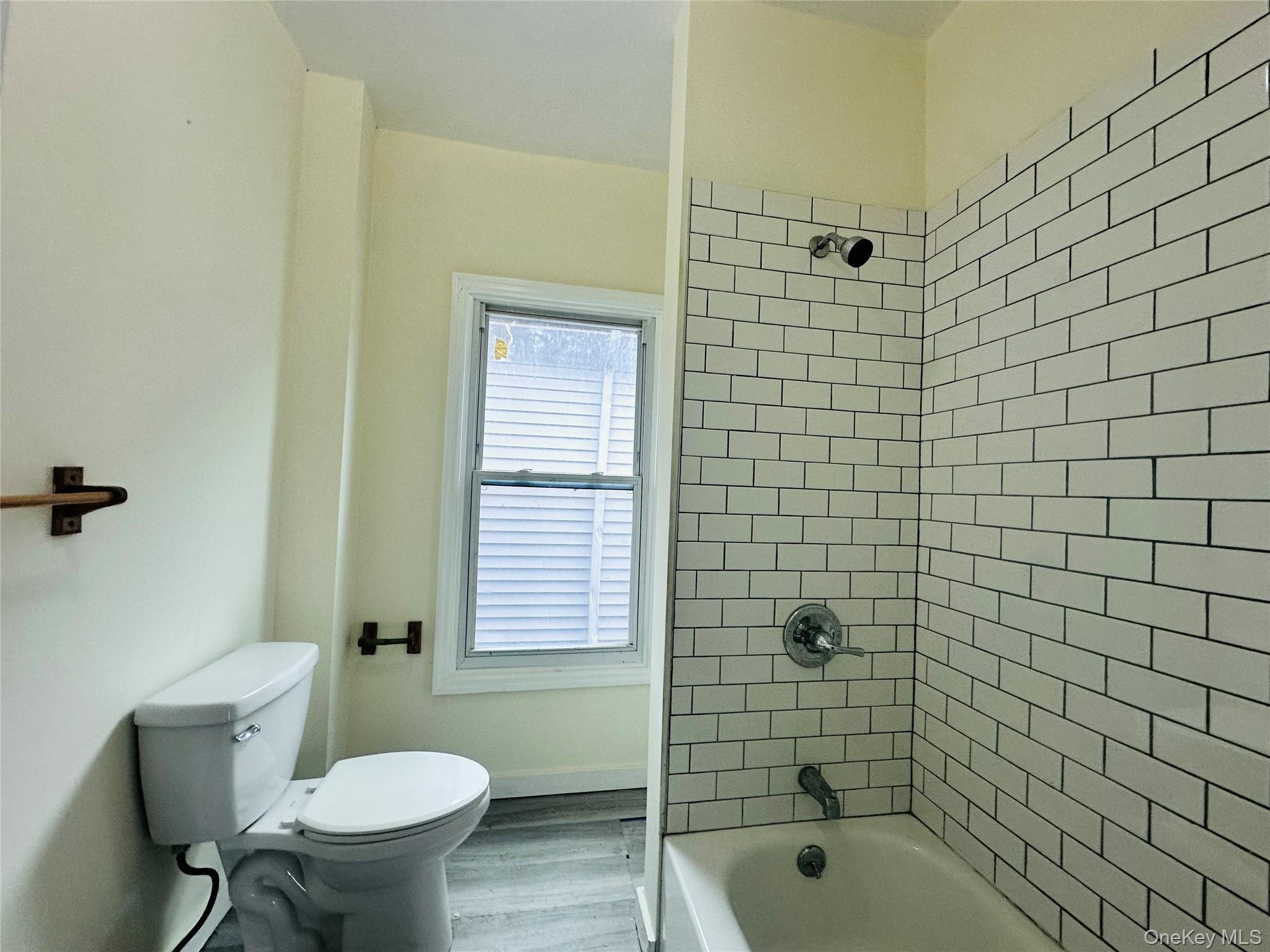 80 North Hamilton Street, Unit 2 Poughkeepsie, NY 12601 - Photo 16 of 17 a bathroom with a shower toilet and sink