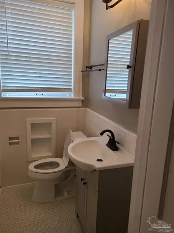 a bathroom with a sink and a toilet