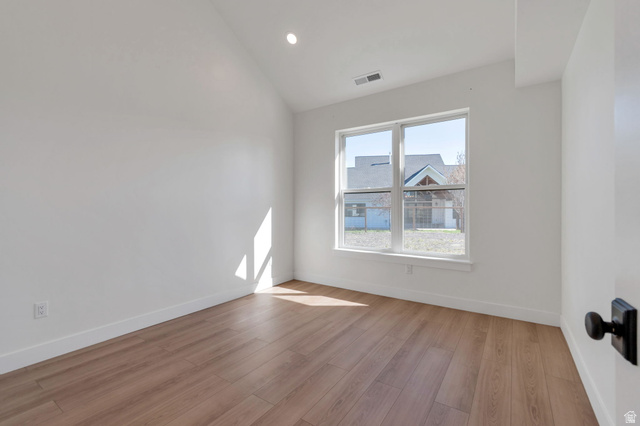 1820 West Farmhouse Flats Road Peoa, UT 84061 - Photo 69 of 79 Room featuring wood-finish flooring, white walls, and a large window
