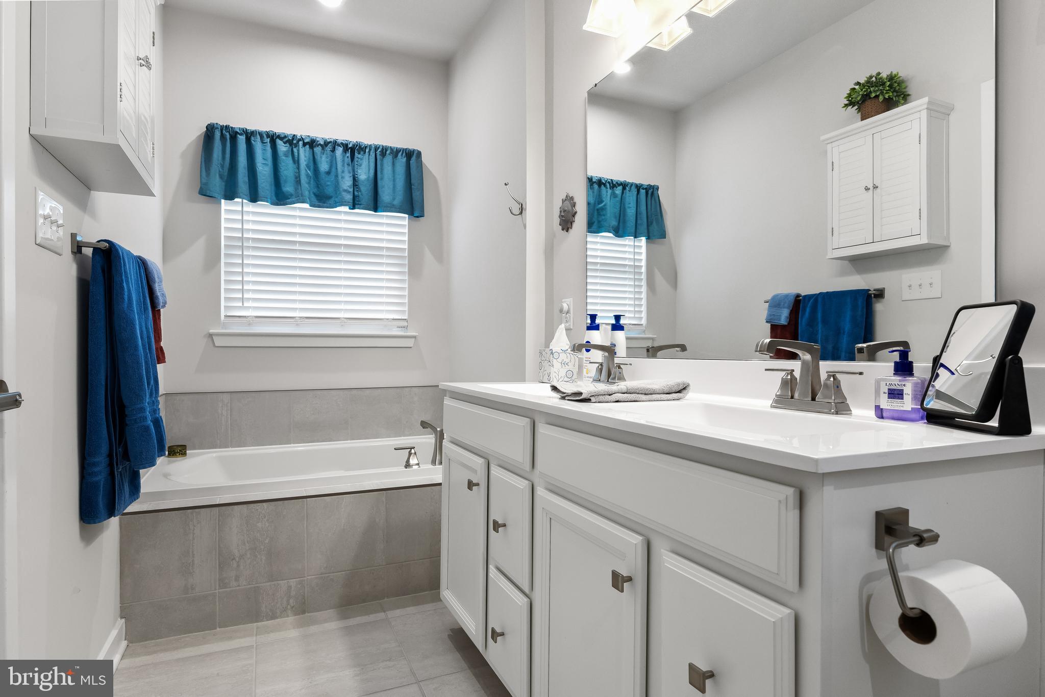 11 Cinnamon Lane Mount Laurel, NJ 08054 - Photo 13 of 17 a bathroom with a sink a vanity and bathtub
