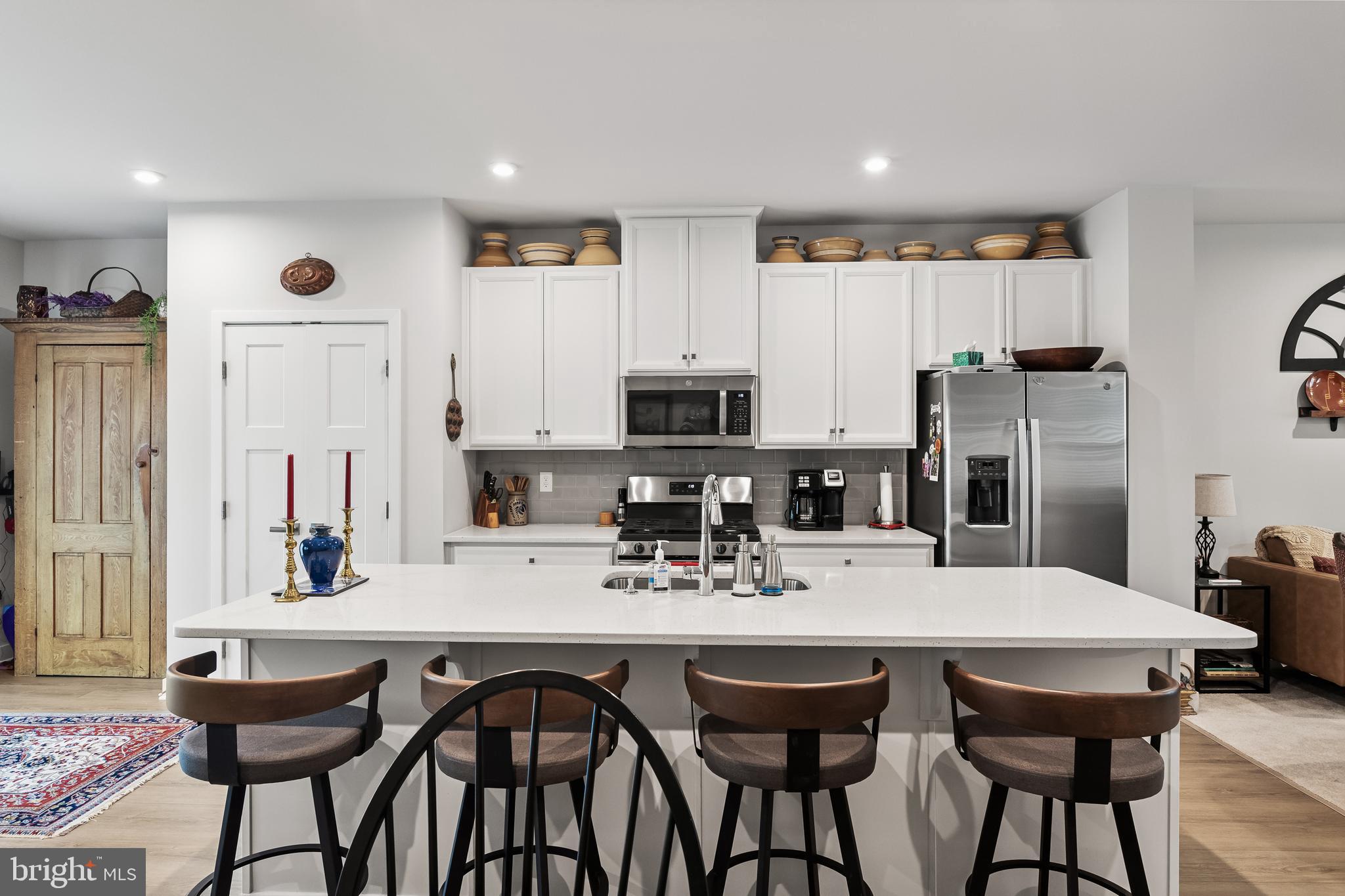 11 Cinnamon Lane Mount Laurel, NJ 08054 - Photo 9 of 17 a kitchen with stainless steel appliances kitchen island granite countertop a dining table and chairs