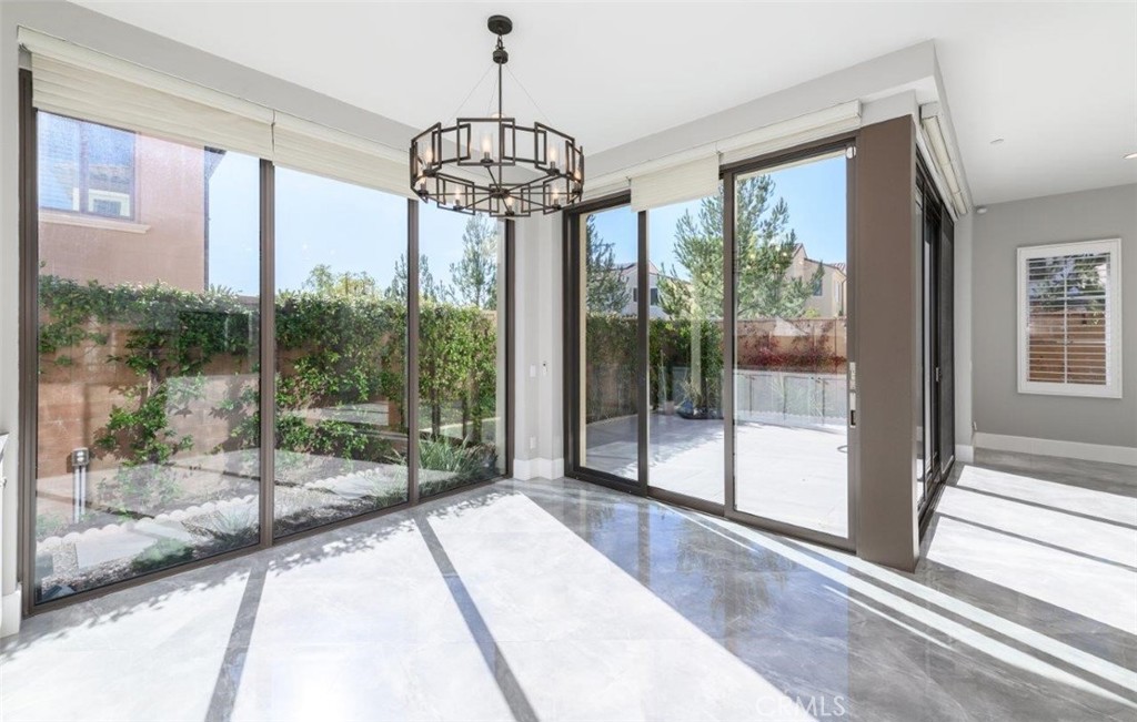 100 Rusina Irvine, CA 92602 - Photo 14 of 46 a view of a room with windows and chandelier