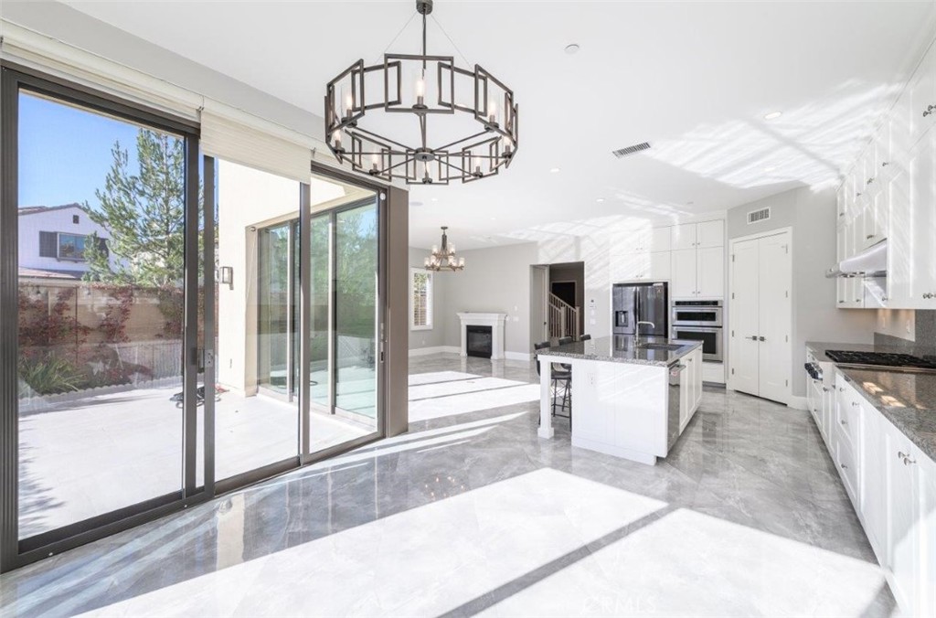 100 Rusina Irvine, CA 92602 - Photo 16 of 46 a very nice looking living room with a large window and chandelier