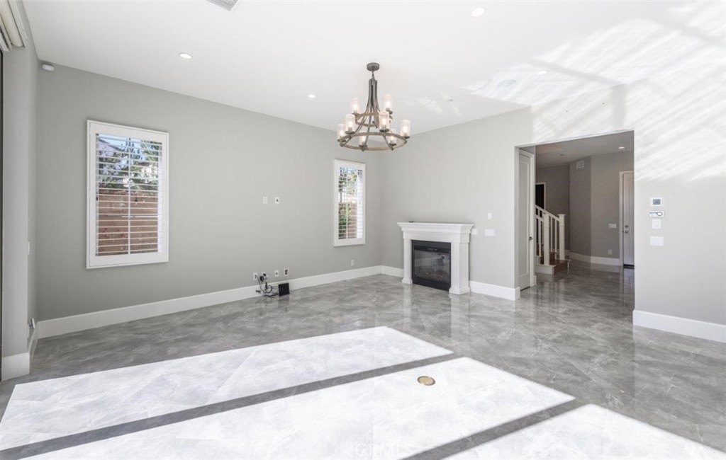 100 Rusina Irvine, CA 92602 - Photo 19 of 46 a view of a livingroom with a kitchen and window