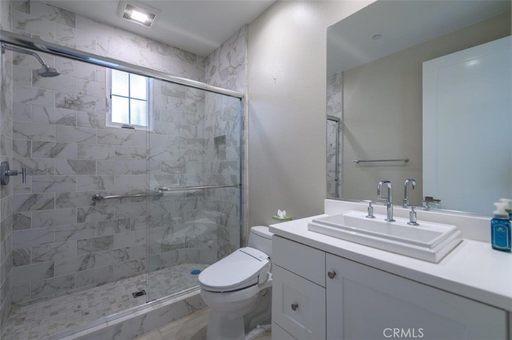 100 Rusina Irvine, CA 92602 - Photo 22 of 46 a bathroom with a sink a toilet and shower