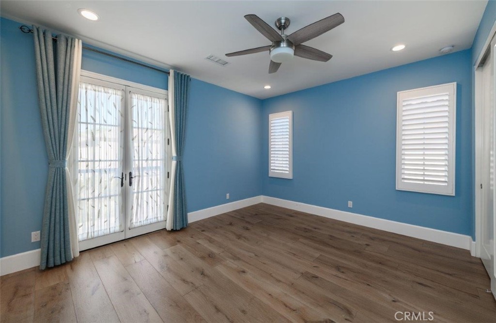 100 Rusina Irvine, CA 92602 - Photo 36 of 46 a view of an empty room with wooden floor and a window