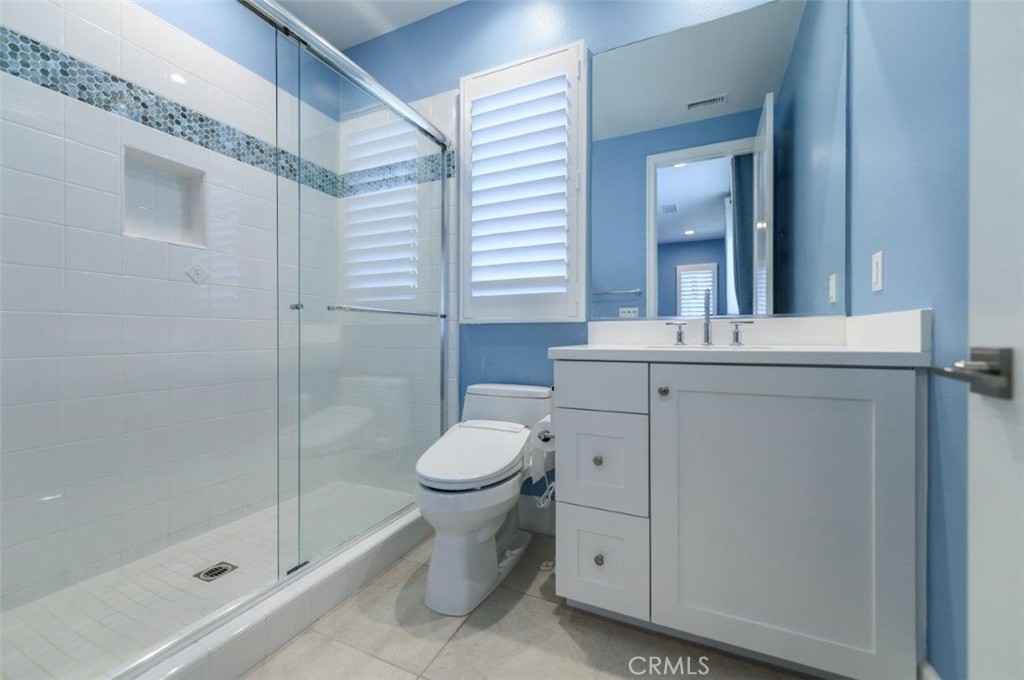 100 Rusina Irvine, CA 92602 - Photo 37 of 46 a bathroom with a sink toilet and shower
