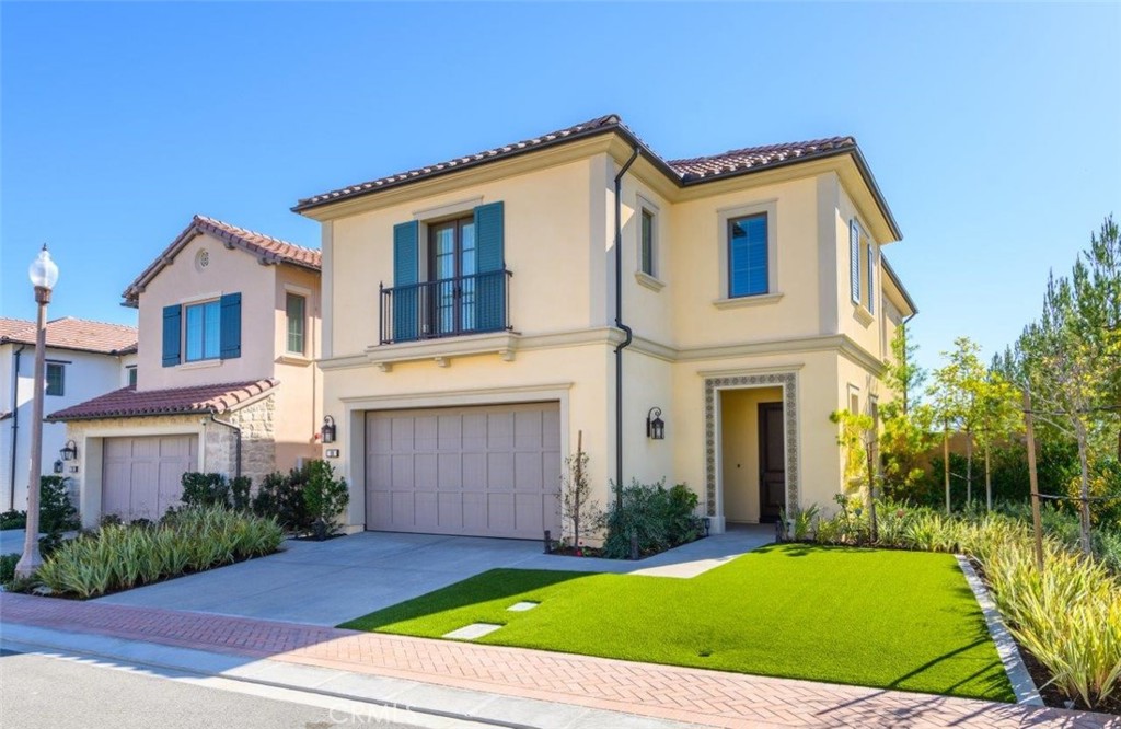 100 Rusina Irvine, CA 92602 - Photo 4 of 46 a front view of a house with a yard and garage