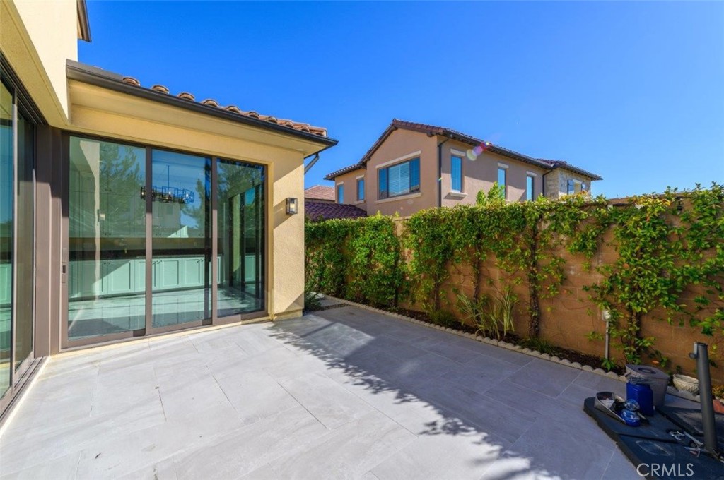 100 Rusina Irvine, CA 92602 - Photo 42 of 46 a front view of a house with a garden