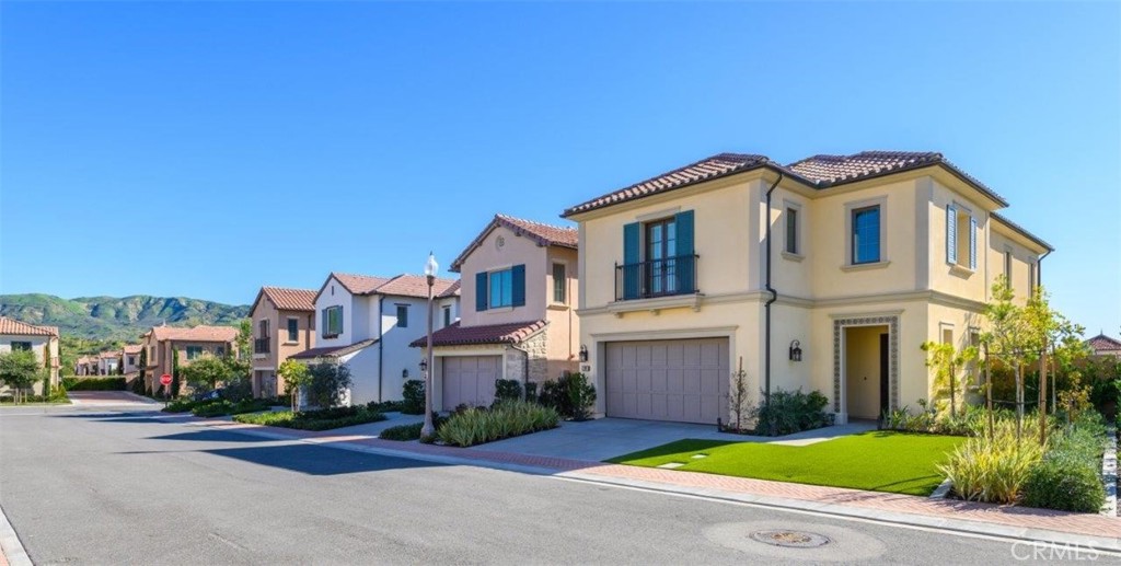 100 Rusina Irvine, CA 92602 - Photo 5 of 46 a front view of a house with yard
