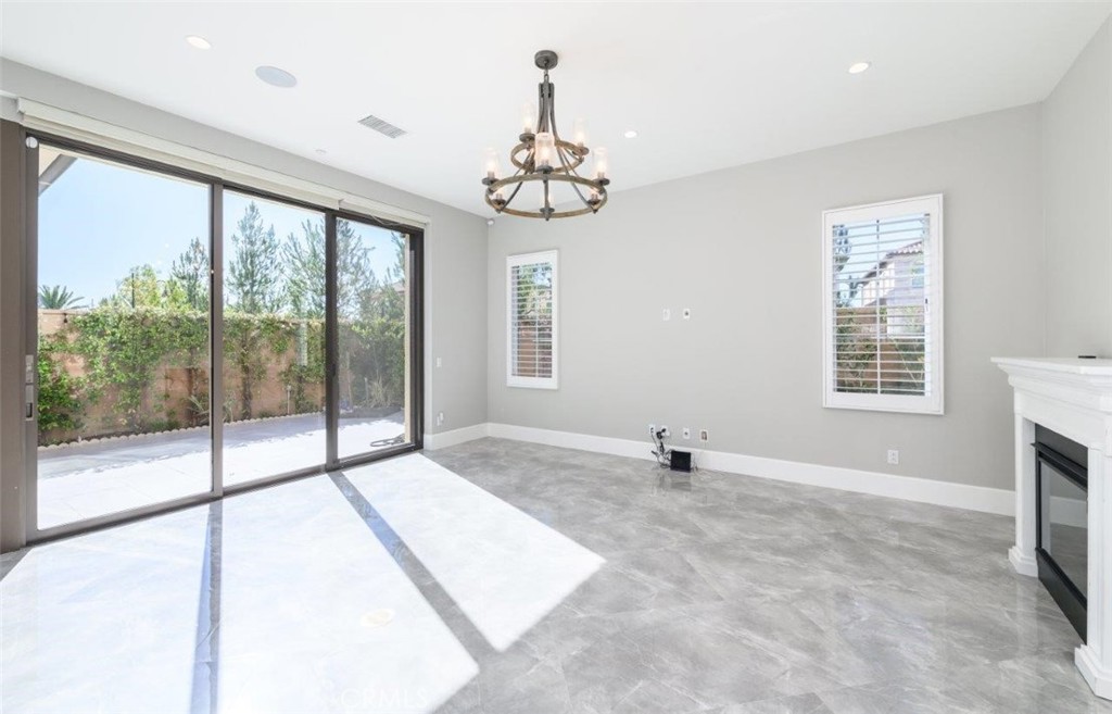 100 Rusina Irvine, CA 92602 - Photo 8 of 46 a view of an empty room with a window