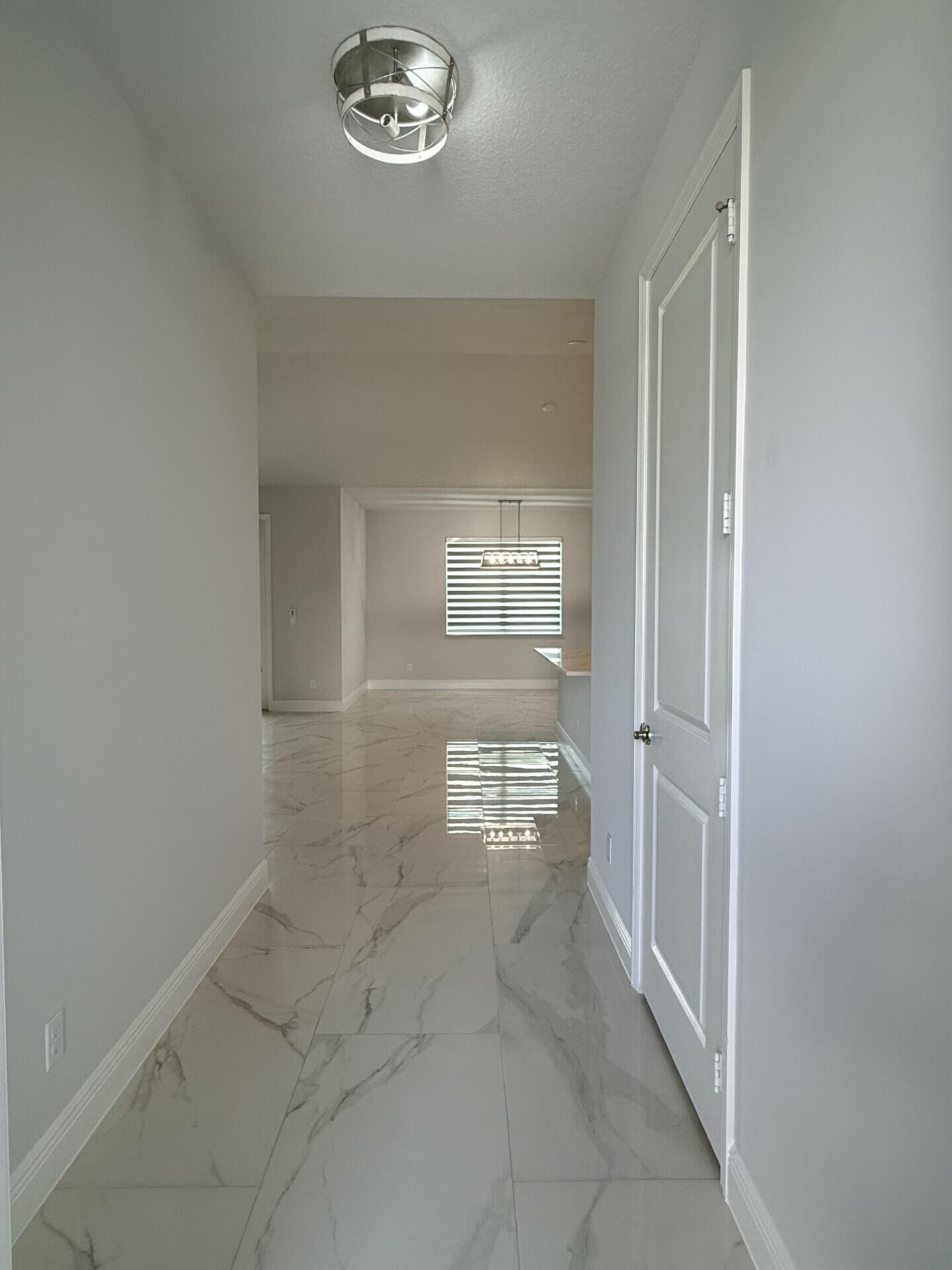5673 Northwest Whitecap Road Port St. Lucie, FL 34986 - Photo 4 of 31 5f06b2c4-2622-44aa-9999-e32cf707c91f