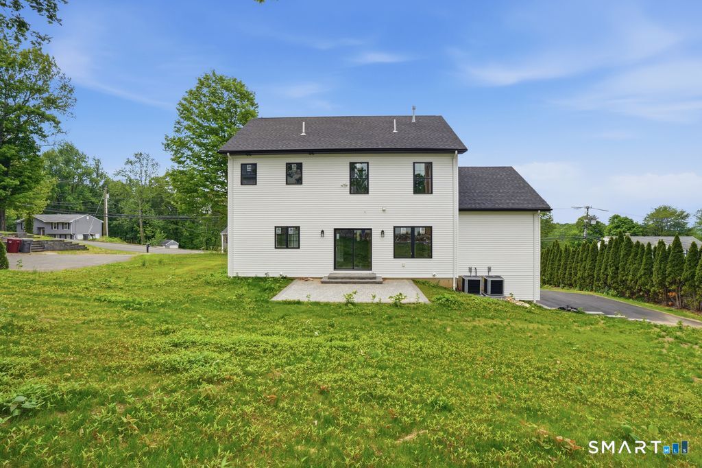 796 Maple Hill Road Naugatuck, CT 06770 - Photo 29 of 35 a view of a house with a yard