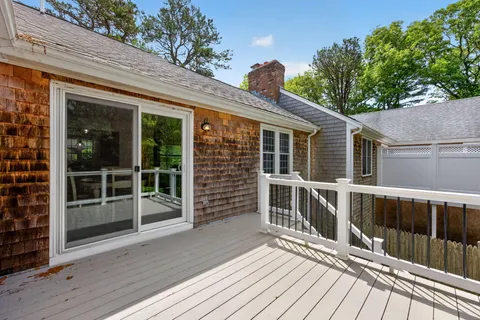 a view of a house with backyard porch and sitting area