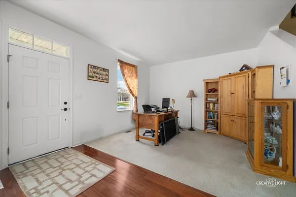 a area with furniture and a refrigerator