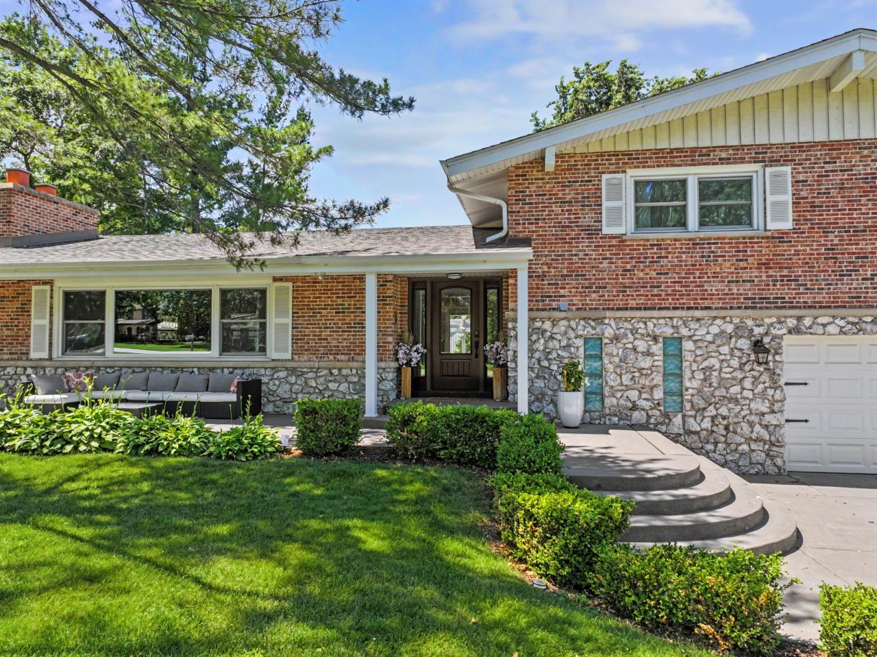 328 Windsor Lane Inverness, IL 60010 - Photo 1 of 33 a front view of a house with a garden and porch