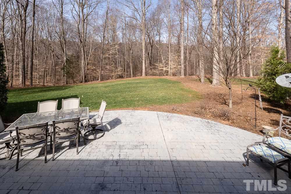 5109 Indigo Moon Way Raleigh, NC 27613 - Photo 22 of 24 a view of backyard with seating area and green space
