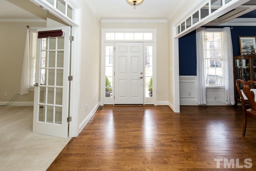 5109 Indigo Moon Way Raleigh, NC 27613 - Photo 4 of 24 an empty room with wooden floor and windows