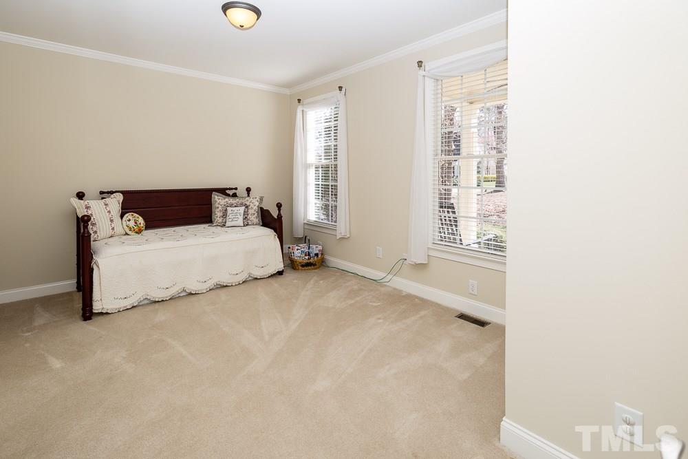 5109 Indigo Moon Way Raleigh, NC 27613 - Photo 5 of 24 a bedroom with a bed and a window