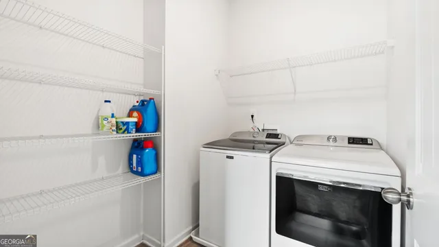 a utility room with dryer and washer