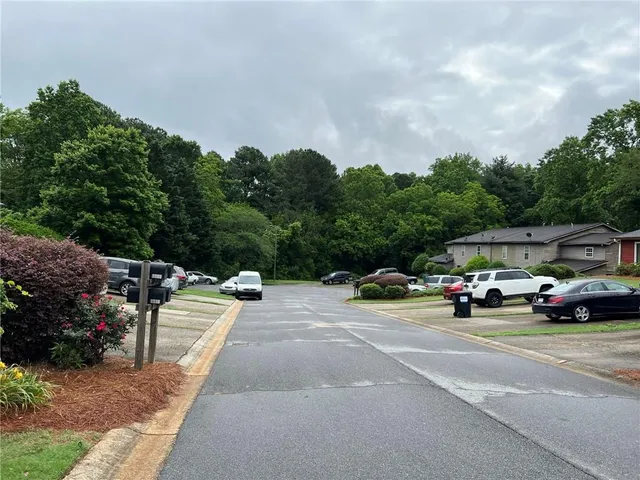 a view of street with parked cars