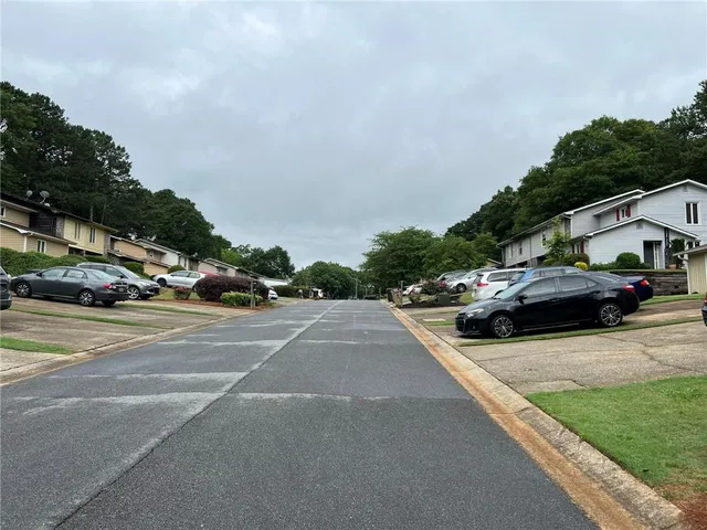 a view of street with parked cars