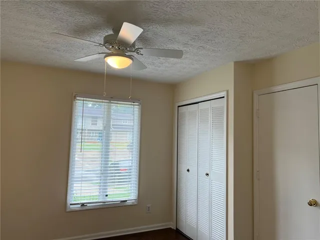 a view of a room with window and cabinet