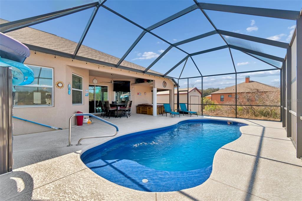 18317 Treehaven Drive Hudson, FL 34667 - Photo 47 of 60 a view of a swimming pool with seating area