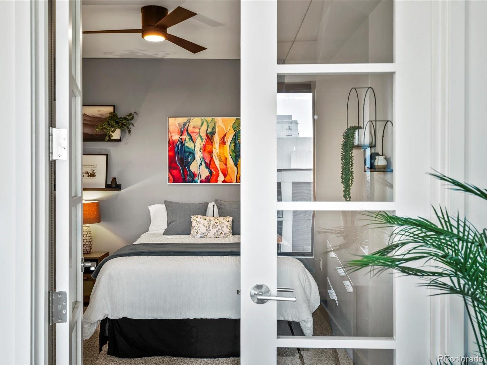 1750 Wewatta Street, Unit 1409 Denver, CO 80202 - Photo 23 of 48 a living room with furniture and a potted plant